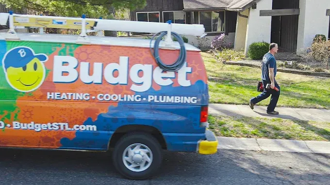 Budget Heating, Cooling & Plumbing van and technician in St. Charles County